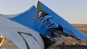 This image released by the Prime Minister's office shows the tail of a Metrojet plane that crashed in Hassana Egypt, Friday, Oct. 31. The Russian aircraft carrying 224 people, including 17 children, crashed Saturday in a remote mountainous region in the Sinai Peninsula about 20 minutes after taking off from a Red Sea resort popular with Russian tourists, the Egyptian government said. There were no survivors.