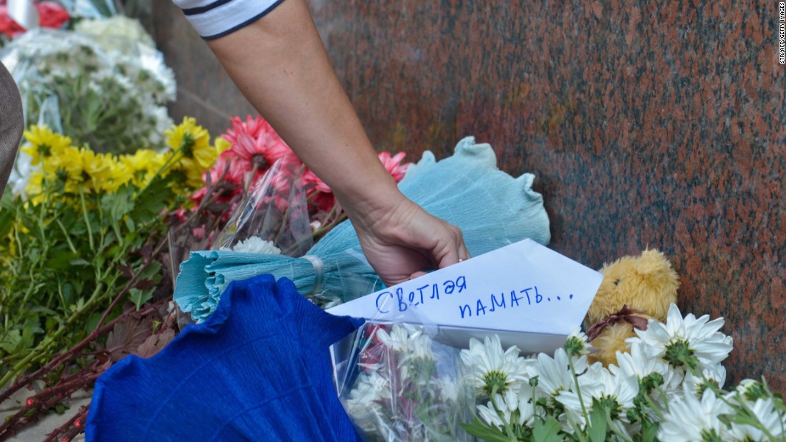 People place flowers and messages in front of the Russian Embassy in Cairo on November 1.  