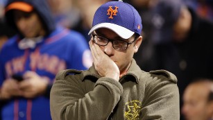 A New York Mets fan reacts during the 12th inning.