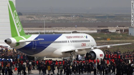 China's first big passenger plane C919, a narrow-body jet which can seat 168 passengers, goes on display at a facility in commercial hub in Shanghai on November 2, 2015.  The C919 rolled off the assembly line as the Asian giant seeks to develop its own aviation sector and challenge foreign industry giants for prestige and market share.                   CHINA OUT    AFP PHOTO        (Photo credit should read STR/AFP/Getty Images)