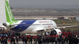 China's first big passenger plane C919, a narrow-body jet which can seat 168 passengers, goes on display at a facility in commercial hub in Shanghai on November 2, 2015.  The C919 rolled off the assembly line as the Asian giant seeks to develop its own aviation sector and challenge foreign industry giants for prestige and market share.                   CHINA OUT    AFP PHOTO        (Photo credit should read STR/AFP/Getty Images)