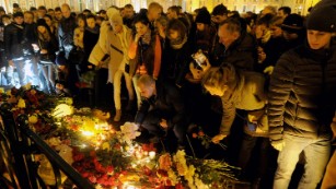 People light candles and place flowers in central Saint Petersburg. 