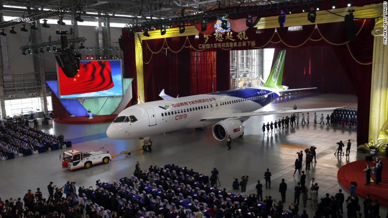 The C919, China&#39;s first large passenger plane, goes on display at an aircraft hangar in Shanghai on November 2, 2015.