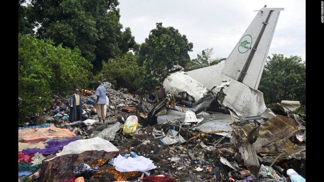 Responders pick through the wreckage of a cargo plane that crashed Wednesday, November 4, in Juba, South Sudan. The Russian-built Antonov-12 transport plane crashed shortly after takeoff, a South Sudanese official said. Three people survived, including an infant.