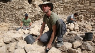 Workers from the Israeli Antiquity Authorities dig on November 3, 2015 at the excavation site near the City of David adjacent to Jerusalem's Old City walls where researchers believe to have found the remains of the stronghold the Acra, from which the Greek King Antiochus IV was able to control Jerusalem and monitor activity at the holy site known to Jews as the Temple Mount. Israel's antiquities body claimed to have solved "one of Jerusalem's greatest archeological mysteries" by unearthing from under a car park the 2,000-year-old citadel, which archaeologists have puzzled for more than a century over its location.