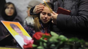 A girl cries during a funeral this month for Nina Lushchenko, 60, a victim of the Metrojet crash.