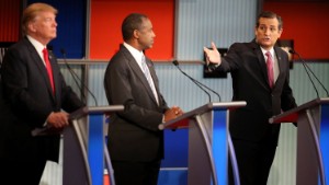 Republican presidential candidate Donald Trump (L) and Ben Carson (C) looks on as U.S. Sen. Ted Cruz (R-TX) speaks during the Republican Presidential Debate sponsored by Fox Business and the Wall Street Journal at the Milwaukee Theatre on November 10, 2015 in Milwaukee, Wisconsin.