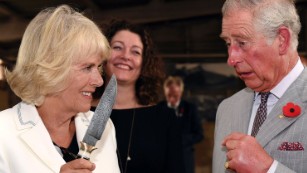 Britain's Prince Charles jokes with his wife Camilla, Duchess of Cornwall during a visit to Seppeltsfield Winery in the Barossa Valley, Australia, Tuesday, Nov. 10, 2015. The Royal couple are on a six-day tour of Australia. (Daniel Kalisz/Pool Photo via AP)