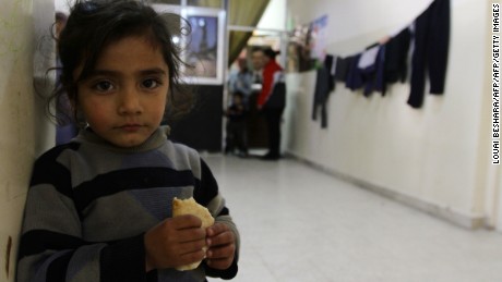 A Syrian refugee is seen at the Taqi Al-Din school in the Dumar neighbourhood of Damascus where many families are taking shelter on February 26, 2013. The Syrian conflict has already claimed more than 70,000 lives in the two years since President Bashar al-Assad's crackdown on anti-regime protesters, leaving another two million people internally displaced and forcing 870,000 refugees to flee to neighbouring states.  AFP PHOTO / LOUAI BESHARA        (Photo credit should read LOUAI BESHARA/AFP/Getty Images)