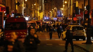 Police forces, firefighters and rescue workers secure the area near the Bataclan concert hall in central Paris, early on Saturday, November 14.