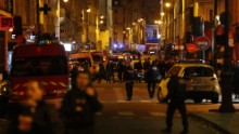 Police forces, firefighters and rescue workers secure the area near the Bataclan concert hall in central Paris, early on Saturday, November 14.