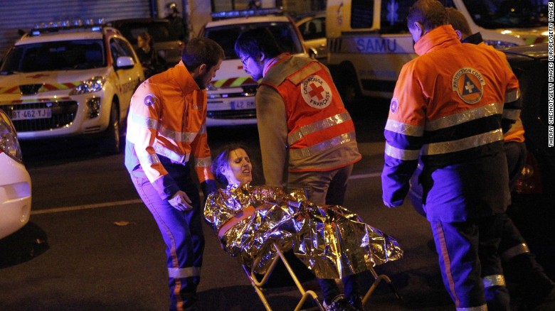 Medics evacuate an injured woman on Boulevard des Filles du Calvaire near the Bataclan early on November 14.