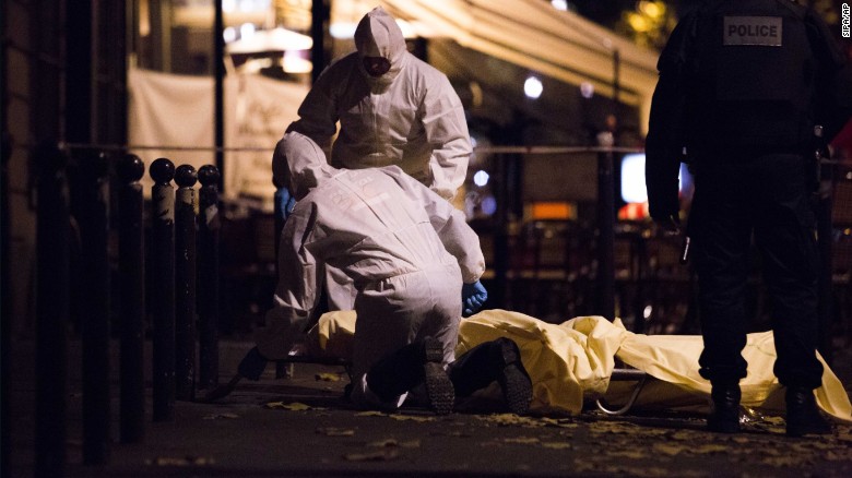 Forensics are working in the street of Paris after the terrorist attack on Friday, November 13. 