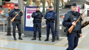 French Police stand guard at the Southern Train Station in Paris, France on November 14 as part of security measures following Friday's attacks.