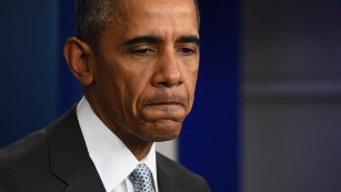 U.S. President Barack Obama looks down as he speaks to the press in Washington, DC on November 13, 2015, after being informed about a series of deadly attacks that rocked Paris.