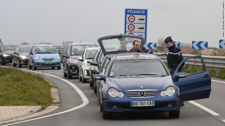 Security personnel inspect vehicles at the border between Belgium and France on Saturday, November 14. French President Francois Hollande declared a state of emergency after Friday&#39;s attacks in Paris and said border security has been ramped up. The terrorist group ISIS claimed responsibility for the attacks. 