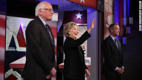 Democratic presidential candidates (L-R) Sen. Bernie Sanders (I-VT), Hillary Clinton and Martin O'Malley stand on the stage prior to a presidential debate sponsored by CBS at Drake University on November 14, 2015 in Des Moines, Iowa.