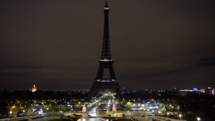 A picture taken on November 14, 2015 shows the Eiffel Tower with its lights turned off following the deadly attacks in Paris.