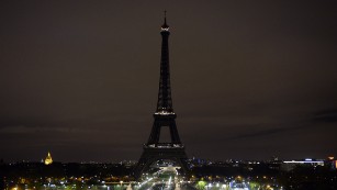 A picture taken on November 14, 2015 shows the Eiffel Tower with its lights turned off following the deadly attacks in Paris.