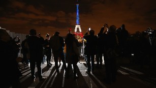 The Eiffel Tower is illuminated in Red, White and Blue in honour of the victims of Friday&#39;s terrorist attacks in Paris. 