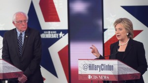 Democratic Presidential hopeful Hillary Clinton (R) speaks as Bernie Sanders looks on during the second Democratic presidential primary debate in the Sheslow Auditorium of Drake University on November 14, 2015 in Des Moines, Iowa. AFP PHOTO/ MANDEL NGAN        (Photo credit should read MANDEL NGAN/AFP/Getty Images)