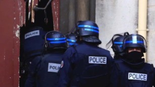Two dead, eight arrested in Paris terror raid