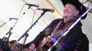 WEST HOLLYWOOD, CA - APRIL 13:  Musican Willie Nelson performs at the John Varvatos 11th Annual Stuart House Benefit presented by Chrysler, Kids Tent by by Hasbro at John Varvatos Boutique on April 13, 2014 in West Hollywood, California.  (Photo by Rachel Murray/Getty Images for John Varvatos)