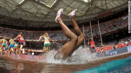 24 Aug 2015 --- (150824) -- BEIJING, Aug. 24, 2015 (Xinhua) -- Panama's Rolanda Bell falls into the water in the heats of the women's 3,000 metres steeplechase at the 2015 IAAF World Championships at the "Bird's Nest" National Stadium in Beijing, capital of China, Aug. 24, 2015. (Xinhua/Li Ming) --- Image by © Li Ming/xh/Xinhua Press/Corbis