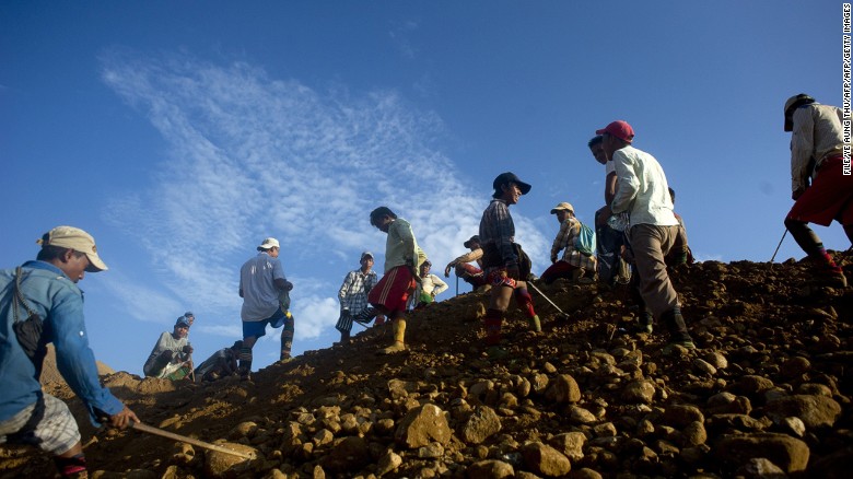 Workers dig for raw jade in piles of rubble next to a jade mine in Hpakant, Myanmar, in October.