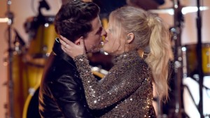 LOS ANGELES, CA - NOVEMBER 22:  Singers Charlie Puth (L) and Meghan Trainor kiss onstage during the 2015 American Music Awards at Microsoft Theater on November 22, 2015 in Los Angeles, California.  (Photo by Kevin Winter/Getty Images)