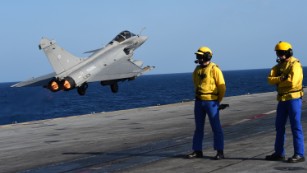 A French fighter jet takes off from the carrier Charles de Gaulle on Monday.