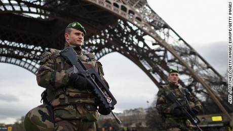 PARIS, FRANCE - JANUARY 12:  French troops patrol around the Eifel Tower on January 12, 2015 in Paris, France. France is set to deploy 10,000 troops to boost security following last week's deadly attacks while also mobilizing thousands of police to patrol Jewish schools and synagogues.  (Photo by Jeff J Mitchell/Getty Images)