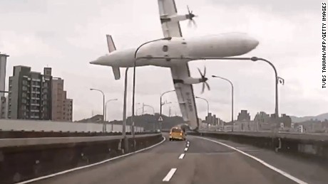 TOPSHOTS
TAIWAN OUT
This screen grab taken from video provided courtesy of TVBS Taiwan on February 4, 2015 shows a TransAsia ATR 72-600 turboprop plane clipping an elevated motorway and hitting a taxi (C) before crashing into the Keelung river outside Taiwan's capital Taipei in New Taipei City. The low-flying passenger plane, TransAsia Flight GE235 with 58 people on board, clipped the bridge and plunged into the river outside Taiwan's capital with at least 11 feared dead and many trapped inside.    TAIWAN OUT  -- AFP PHOTO / TVBS Taiwan
---EDITORS NOTE--- RESTRICTED TO EDITORIAL USE - MANDATORY CREDIT "AFP PHOTO / TVBS Taiwan" - NO MARKETING NO ADVERTISING CAMPAIGNS - DISTRIBUTED AS A SERVICE TO CLIENTS - NO ARCHIVESTVBS Taiwan/AFP/Getty Images