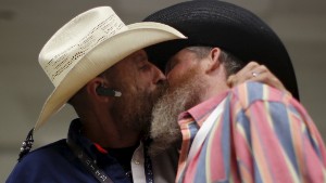 Image #: 40580827    Gordon Satterly, 61, from Michigan (L) kisses his husband Richard Brand, 53, from Texas, at the International Gay Rodeo Association's Rodeo In the Rock party in Little Rock, Arkansas, United States April 24, 2015. Contestants at the International Gay Rodeo in Arkansas, a Bible Belt state with a same-sex marriage ban on its books, competed in events from barrel racing to bull riding on the soft soil of a fairground that looked like just any small-scale rodeo held throughout the United States. The U.S. Supreme Court is expected to rule in June whether to strike down bans on gay marriage nationwide. Arkansas has been one of the front-line states in the battle between cultural conservatives and those seeking expanded rights for the lesbian, gay, bisexual and transgender (LGBT) community. REUTERS/Lucy Nicholson /LANDOV
