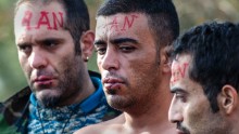 The 'Iranian' men are protesting the Macedonian government's decision to only allow Syrians, Iraqis and Afghans -- those fleeing war - to pass across the border.