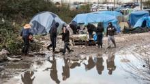 Migrants and refugees in the migrant camp known as the "Jungle" near the northern French port of Calais where some 4,500 people live.