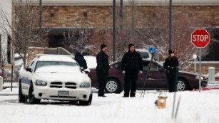 Police investigators work near a Planned Parenthood clinic Saturday, Nov. 28, 2015, in Colorado Springs, Colo., after a deadly shooting Friday. A gunman engaged in an hours-long standoff before surrendering at the clinic.  (AP Photo/David Zalubowski)