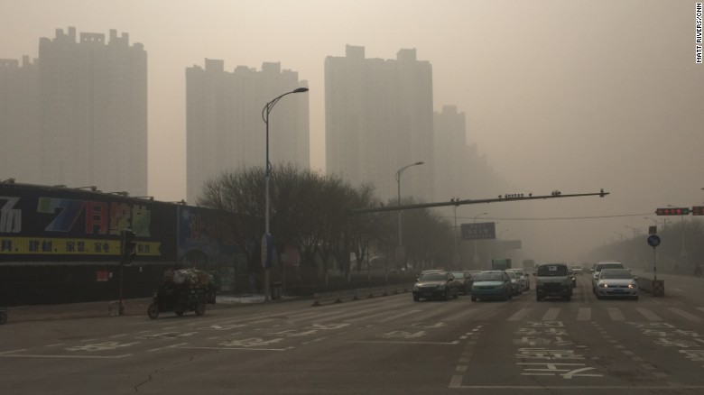 Roads and buildings in Baoding, China are seen shrouded in heavy smog on November 30, 2015, where the air quality index (AQI) has reached a 'hazardous' level.