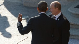 ST. PETERSBURG, RUSSIA - SEPTEMBER 05:  In this handout image provided by Host Photo Agency, Russian President Vladimir Putin (L) greets U.S. President Barack Obama at the G20 summit on September 5, 2013 in St. Petersburg, Russia. The G20 summit is expected to be dominated by the issue of military action in Syria while issues surrounding the global economy, including tax avoidance by multinationals, will also be discussed during the two-day summit.  (Photo by Alexei Danichev/Host Photo Agency via Getty Images)