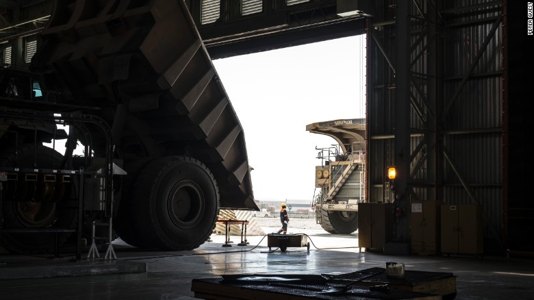 A worker inspects a 300-tonne truck at the Jwaneng diamond mine in Botswana, November 2015
