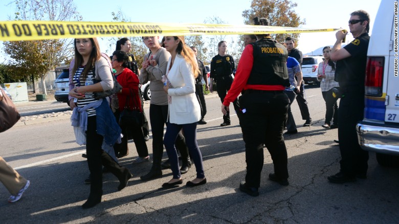 Survivors are evacuated from the scene of a shooting under police and sheriff's escort on December 2, 2015 in San Bernadino, California.  One or more gunman opened fire inside a building in San Bernardino in California, with reports of 20 victims at a center that provides services for the disabled. Police were still hunting for the shooter, saying one to three possible suspects were involved. Heavily armed SWAT teams, firefighters and ambulances swarmed the scene, located about an hour east of Los Angeles, as police warned residents away.  AFP PHOTO / FREDERIC J. BROWN / AFP / FREDERIC J. BROWN        (Photo credit should read FREDERIC J. BROWN/AFP/Getty Images)