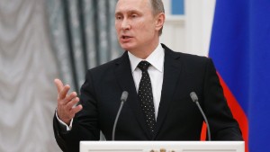 Russian President Vladimir Putin speaks at a news conference after the meeting with his French counterpart Francois Hollande, in Moscow, Russia, Thursday, Nov. 26, 2015. French President Francois Hollande is in Moscow on Thursday to push for a stronger coalition against Islamic State militants in Syria, trying to unite France, the U.S. and Russia. (AP Photo/Alexander Zemlianichenko, pool)
