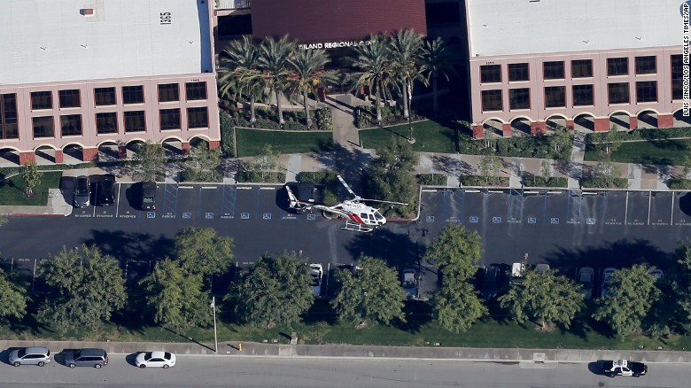 A police helicopter hovers around the Inland Regional Center.