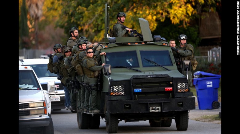 A SWAT team mobilizes during the search.