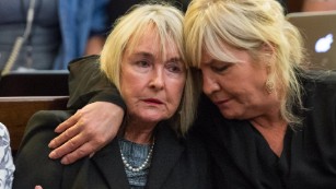 June Steenkamp, left, mother of Reeva Steenkamp, is comforted during proceedings.