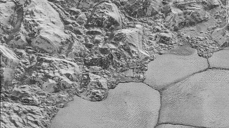 NASA has released the clearest images yet of the surface of Pluto. This photo shows the the mountainous shoreline of Sputnik Planum. &quot;The mountains bordering Sputnik Planum are absolutely stunning at this resolution,&quot; said New Horizons science team member John Spencer of the Southwest Research Institute. &lt;a href=&quot;http://www.nasa.gov/image-feature/the-mountainous-shoreline-of-sputnik-planum&quot; target=&quot;_blank&quot;&gt;Read full caption.&lt;/a&gt;