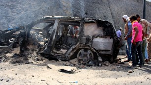 Yemenis check the scene of a car bomb attack Sunday, December 6, in Aden, Yemen. &lt;a href=&quot;http://www.cnn.com/2015/12/06/middleeast/yemen-aden-governor-killed/index.html&quot;&gt;Aden Gov. Jaafar Saad and six bodyguards died in the attack&lt;/a&gt;, for which the terror group ISIS claimed responsibility.