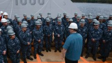 Deputy Defense Secretary Bob Work speaks with the Zumwalt crew during a visit to Bath Iron Works in Bath, Maine, on May 12. Work toured the ship and observed its progress. One thing that sets the $3 billion ship apart is its very small crew. Compared with about 300 sailors needed for similar warships, the Zumwalt's minimum compliment is only 130. The smaller crew is made possible by advanced automated systems which "make it much easier and much more effective for the sailor to operate," says former Navy Capt. Wade Knudson, who now serves as Zumwalt program director for Pentagon contractor, Raytheon. 