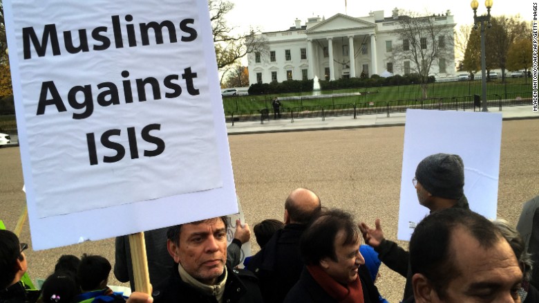A Shia Muslim holds a banner in protest against ISIS and the use of terrorism in the name of Islam during a religious procession of US Shia Muslims at Lafayette Square, outside the White House in Washington, DC on December 06, 2015. AFP PHOTO/MLADEN ANTONOV / AFP / MLADEN ANTONOV        (Photo credit should read MLADEN ANTONOV/AFP/Getty Images)