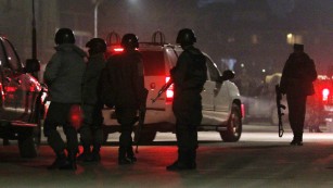 Members of the Afghan security services arrive at the scene of the explosion in Kabul.